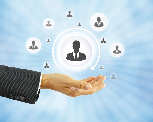 Hand holding businessman icon - HR concept 