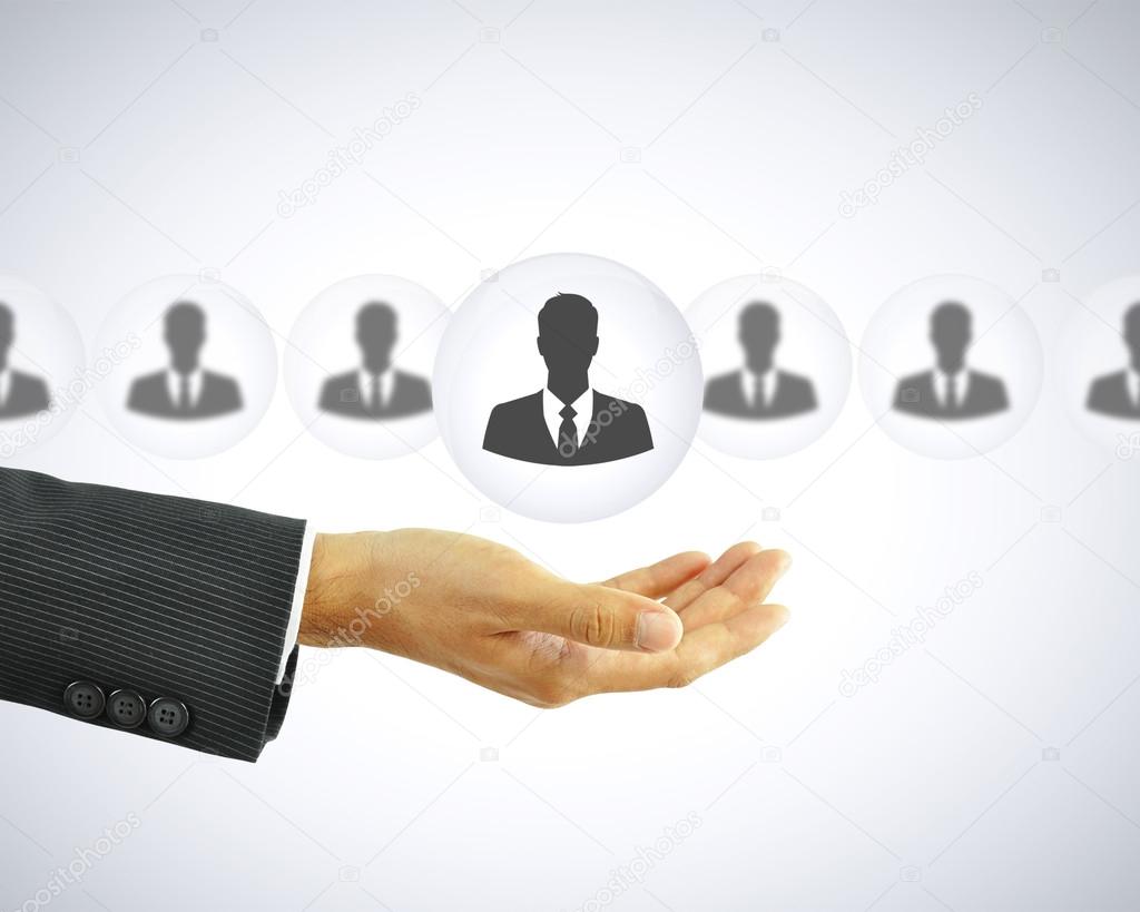 Hand holding businessman icon - HR concept 