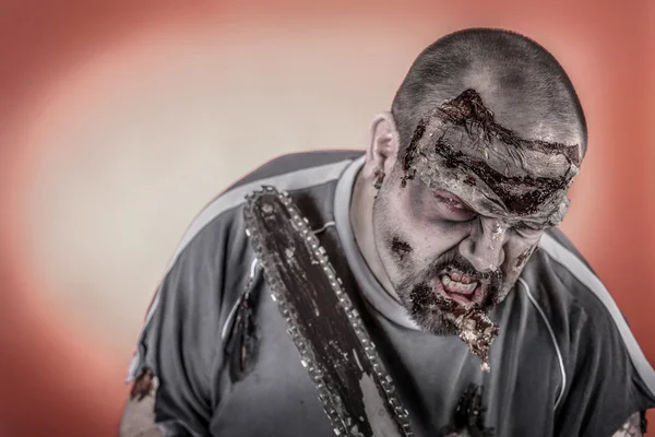 Zombie with mechanical saw — Stock Photo, Image