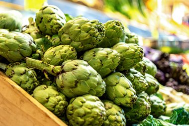 Vegetable market. Stall with artichokes and other vegetables