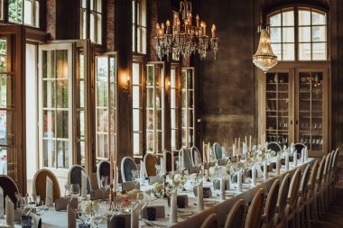 Large table with festive serving in an old restaurant