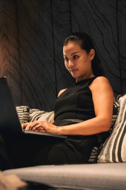 Business woman using a laptop to work online. High quality photo