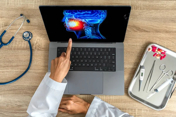 Dentist showing a x-ray of pain in the mouth. High quality photo