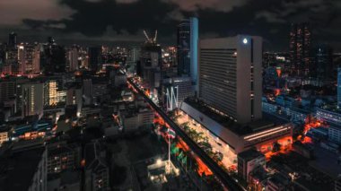 Timelapse Bangkok Thailand. Skytrain, traffic and buildings at night. High quality 4k footage