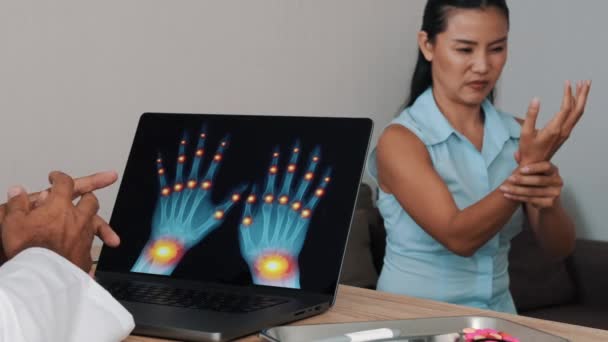 Doctor Showing Ray Pain Wrists Joints Hands Laptop Woman Patient — Vídeo de Stock