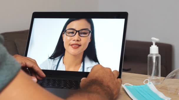Doctor Having Distant Online Conversation Man Patient Thumb Sanitizer Mask — Vídeo de Stock