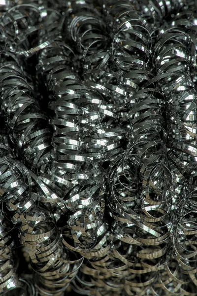 steel tangled spiral metal fibers background, macro photography close-up