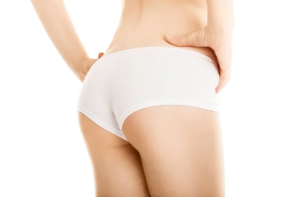 Sexy Gesäß der schlanken Frau auf weißem Hintergrund lizenzfreie Stockbilder
