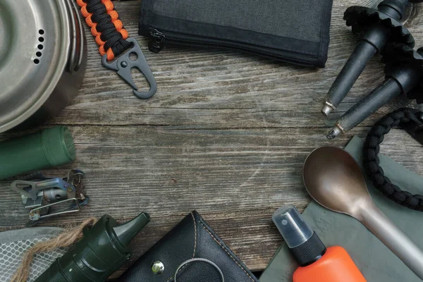 Hiking or survival gear  on wooden background