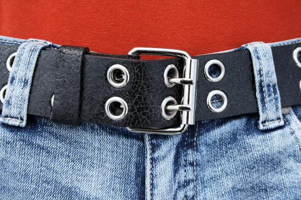 Black leather belt and blue jeans — Stock Photo, Image