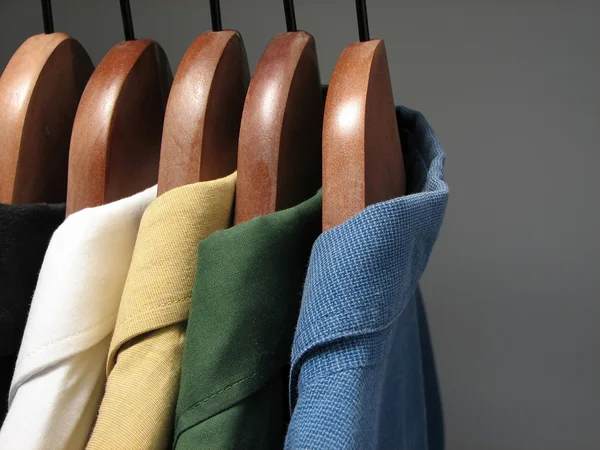 Colorful shirts in a closet — Stock Photo, Image