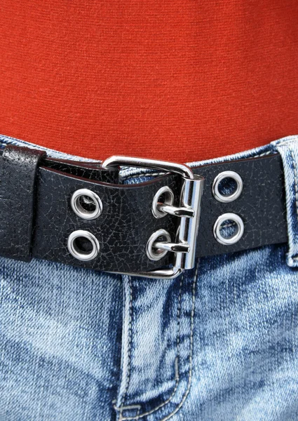 Black leather belt and orange shirt — Zdjęcie stockowe