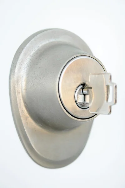 Metallic door lock with a key — Stock Photo, Image