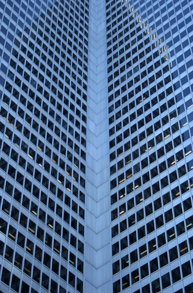 Inside corner of a glass-windowed office tower — Stock Photo, Image