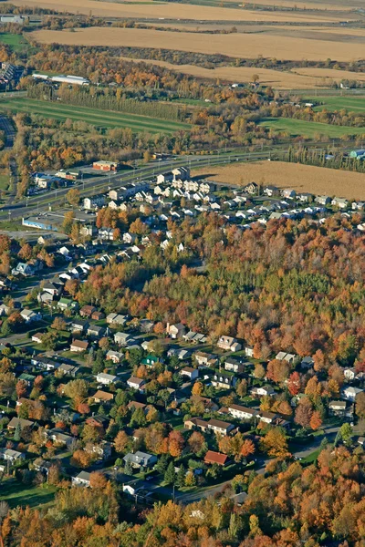 Aerial view of houses and fields — Stock Photo, Image