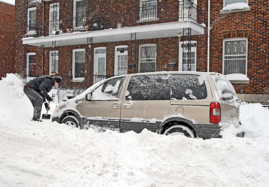 Man shovelling after a snow storm