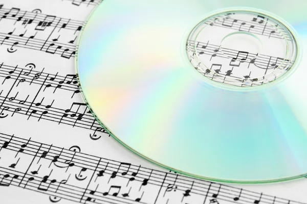 Audio CD and music notes — Stock Photo, Image