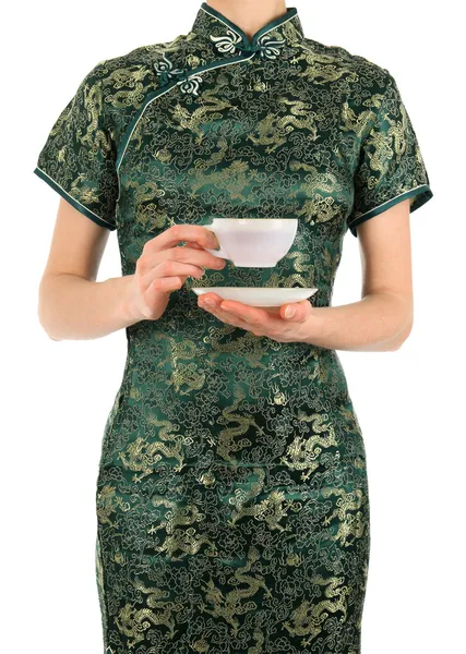 Woman in Chinese dress holding a cup of tea — Stock Photo, Image