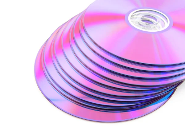 Pilha de vibrantes DVDs roxos ou CDs — Fotografia de Stock