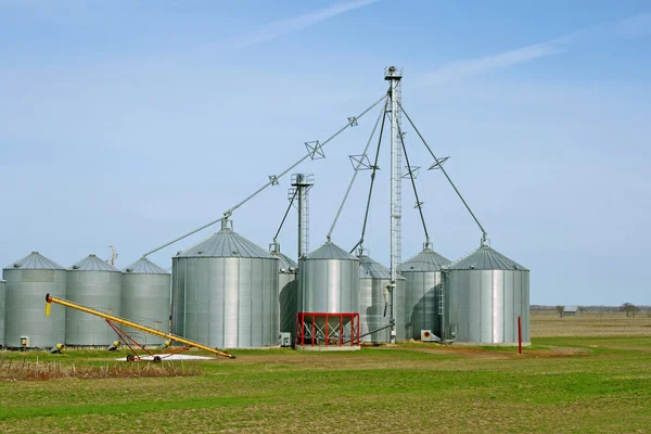 Grain silos on a farm in spring — Stock Photo, Image