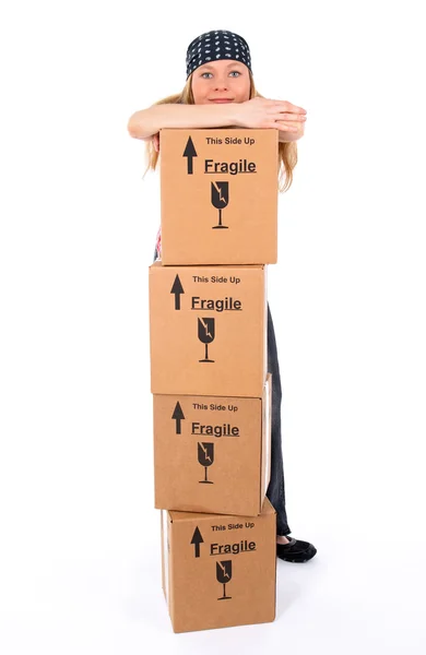 Girl with a stack of cardboard boxes — Stock Photo, Image