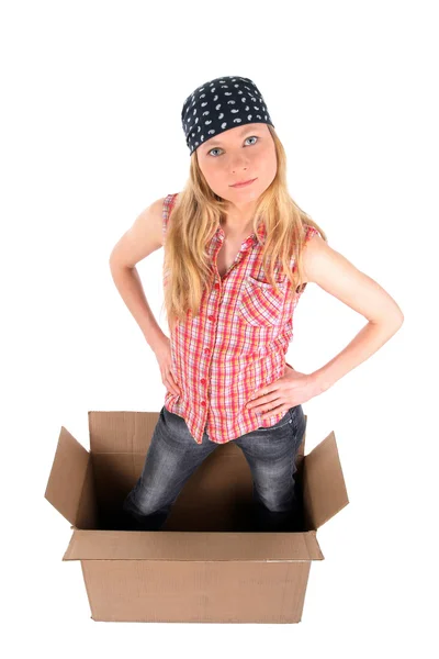 Girl in a cardboard box, looking up — Stock Photo, Image