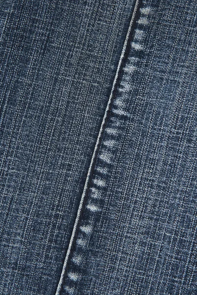 Ткань из синей джинсы со стежком — стоковое фото