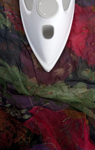 Ironing colorful delicate silk — Stock Photo, Image