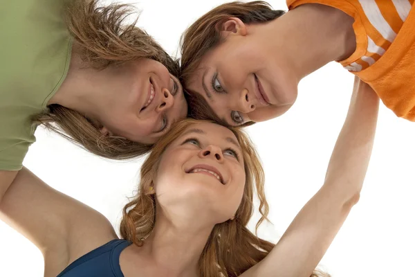 Three happy friends looking at each other Stock Photo