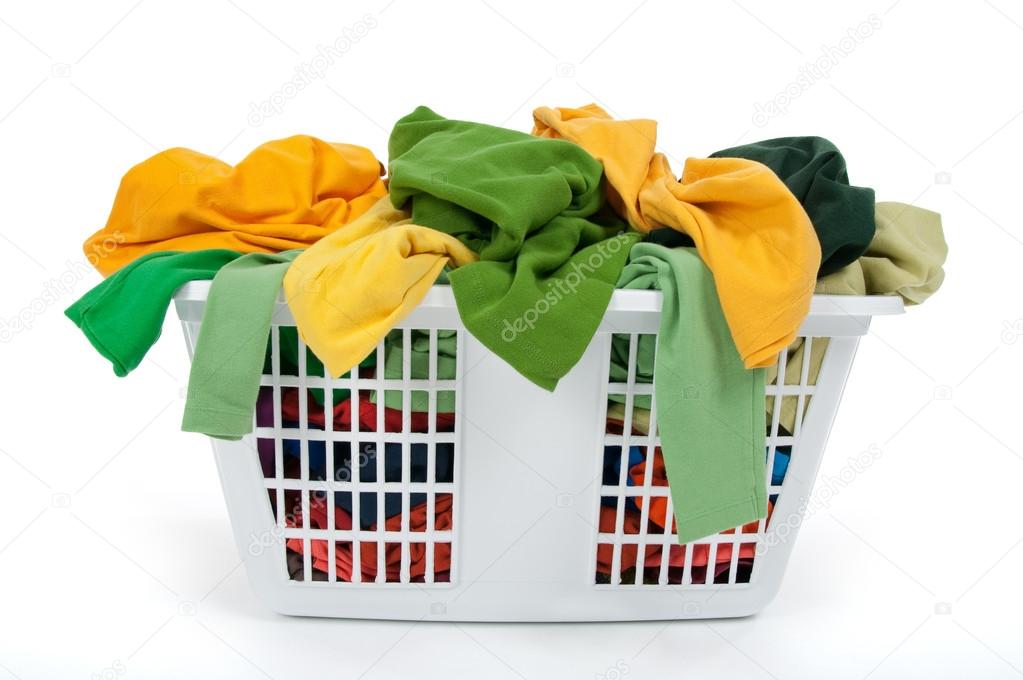 Colorful clothes in laundry basket. Green, yellow.