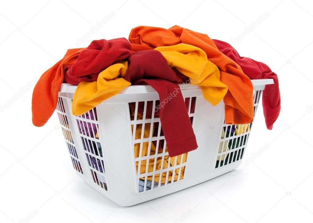 Bright clothes in laundry basket. Red, orange, yellow.