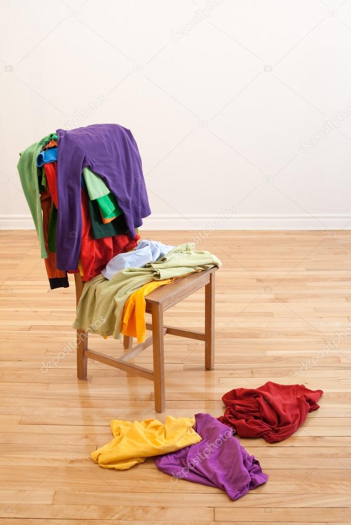 Colorful messy clothes on a chair