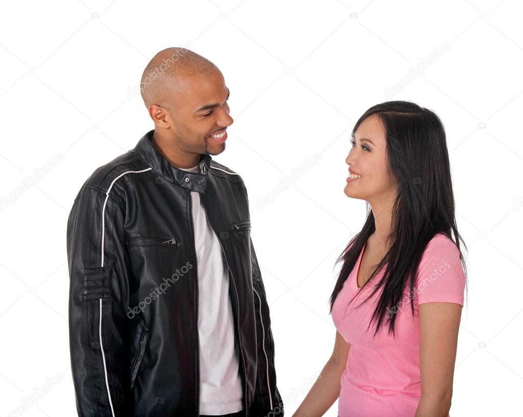 Smiling girl and guy looking at each other