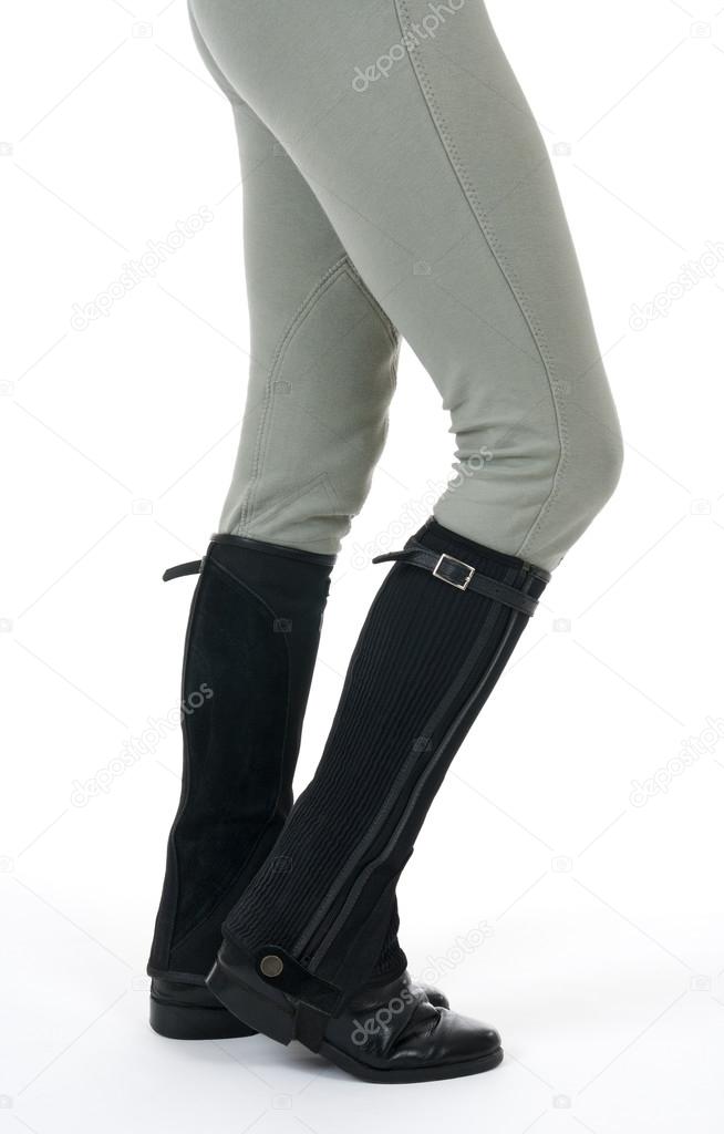 Woman wearing horse riding boots and breeches