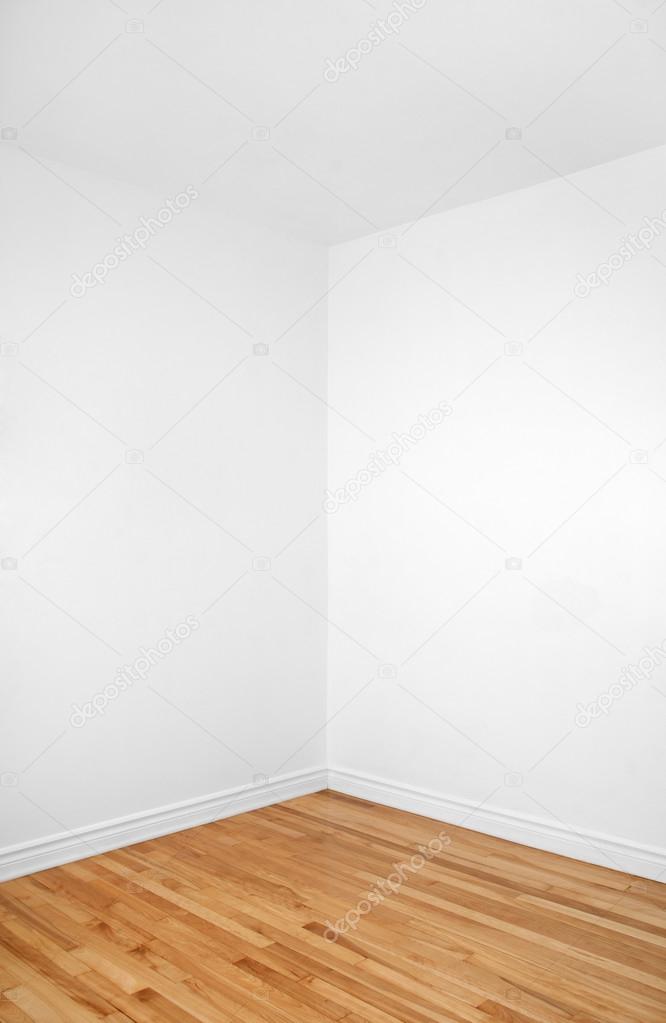 Empty corner of a room with wooden floor