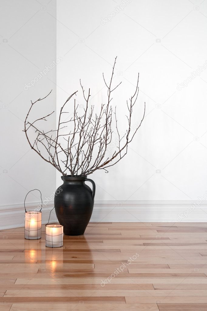 Lanterns and tree branches decorating a room