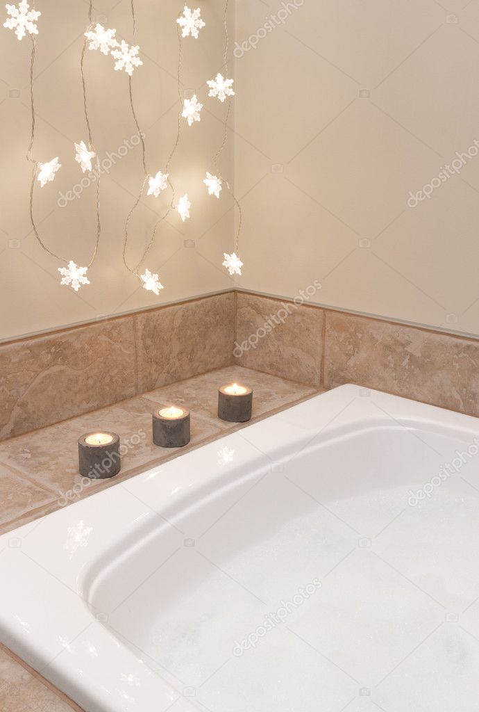 Bathroom decorated with cozy lights and candles