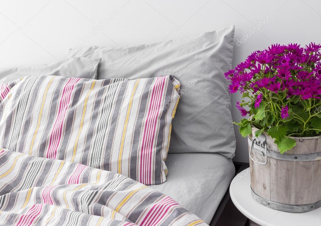 Bedroom decorated with bright purple flowers