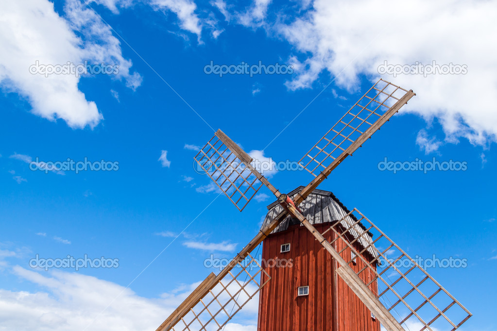 Wooden windmill under blue sky