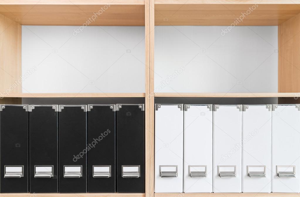 Bookcase with black and white folders