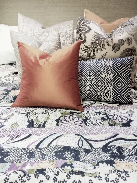 Bed with lots of colorful pillows — Stock Photo, Image