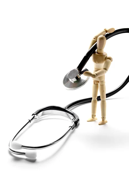 Wooden mannequin holding a stethoscope — Stock Photo, Image