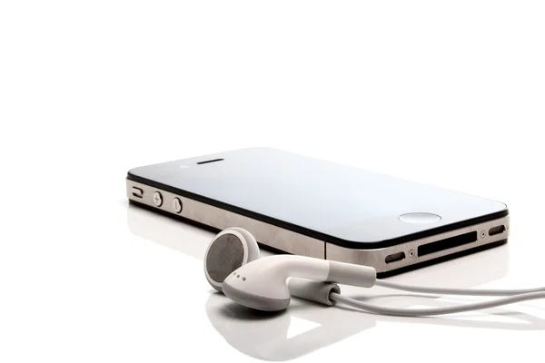 Iphone 4S and earphones — Stock Photo, Image