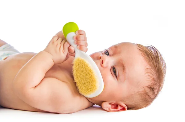 Bebê com escova de cabelo — Fotografia de Stock