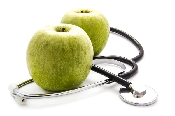 リンゴと聴診器の背景 — ストック写真