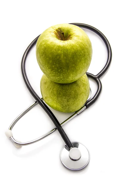 Apples and stethoscope — Stock Photo, Image