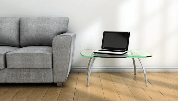Ноутбук и диван — стоковое фото