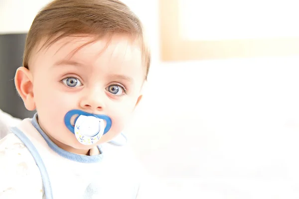 Baby with pacifier — Stock Photo, Image