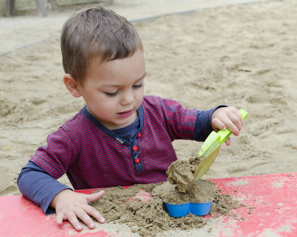 Child playing in sandpit