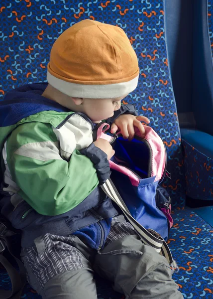 Child with backpack on train. — Stock Photo, Image